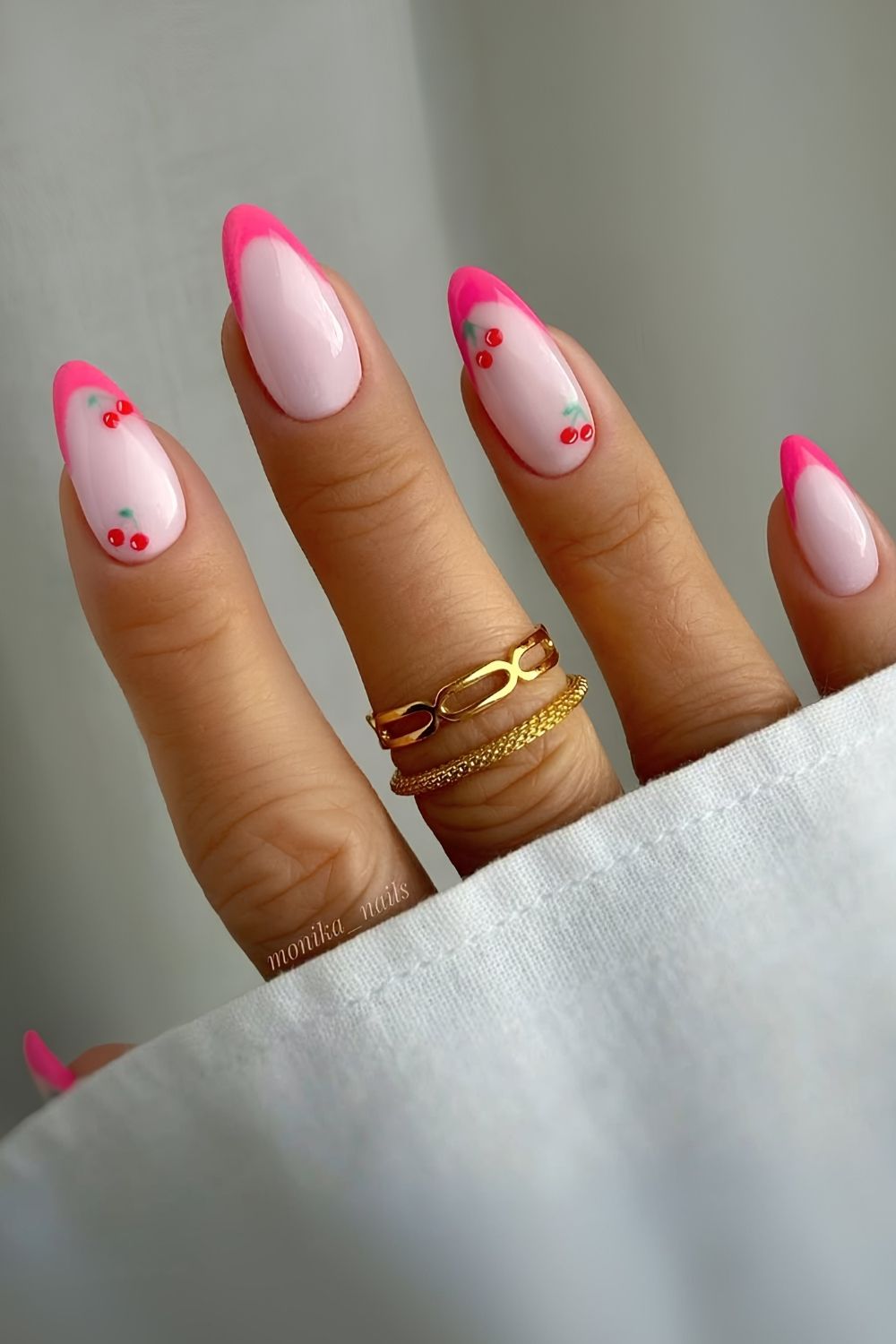 Bright pink French mani with cherry art