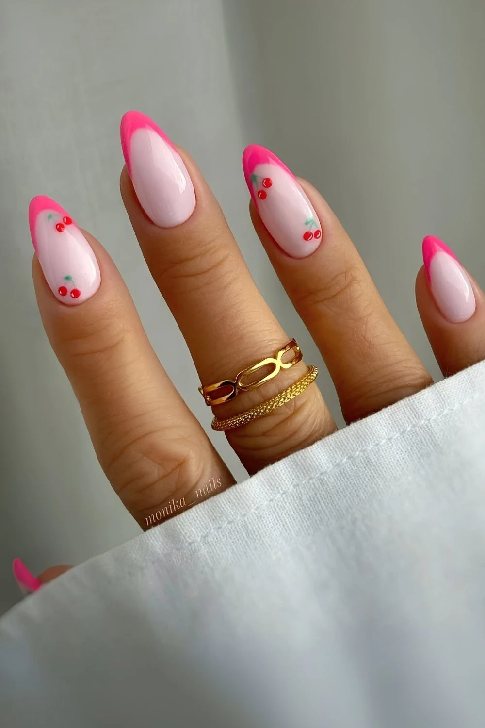 Bright pink French mani with cherry art