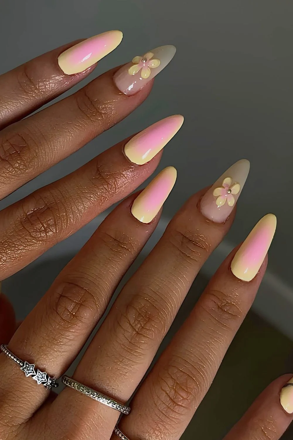 Bright yellow and pink aura nails with 3d flower
