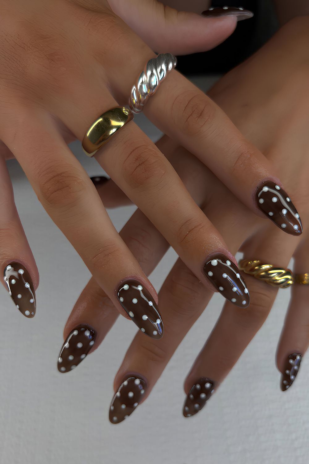 Brown nails with pink polka dots