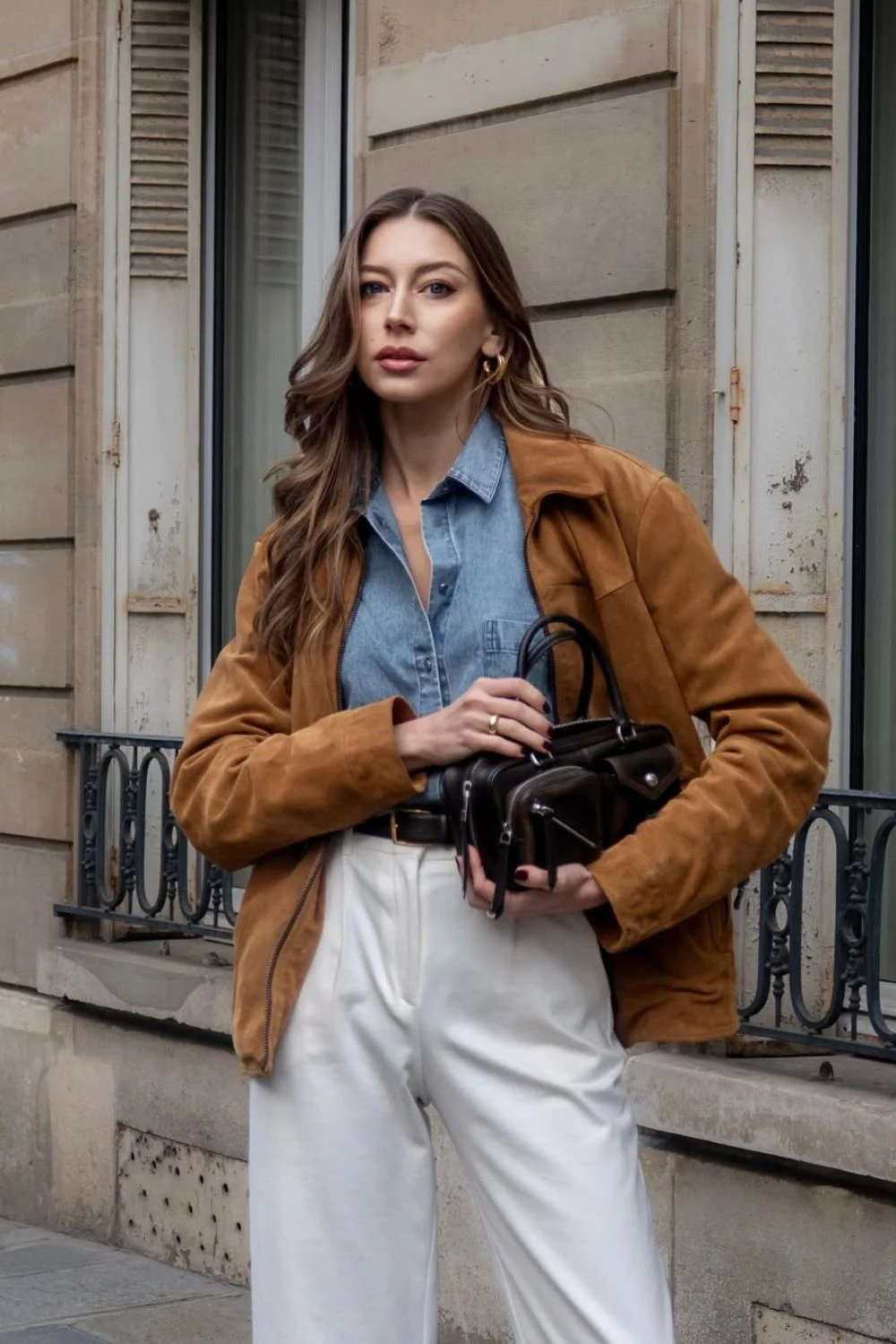 Camel suede jacket with denim shirt and white pants
