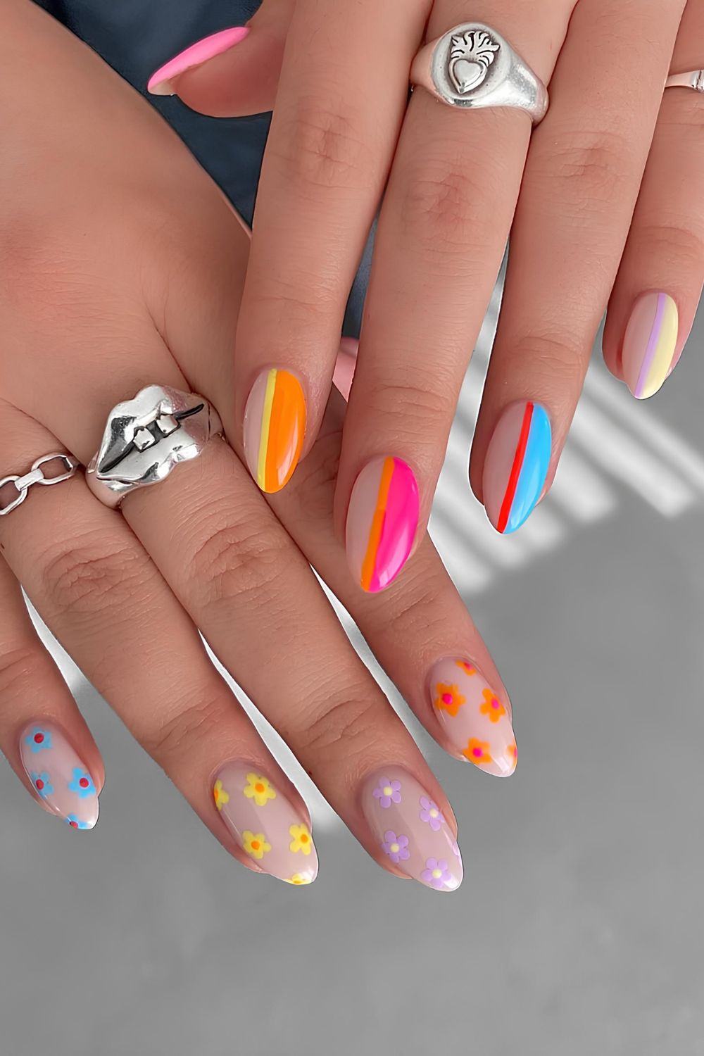Colorful nails with bright color flowers and stripes