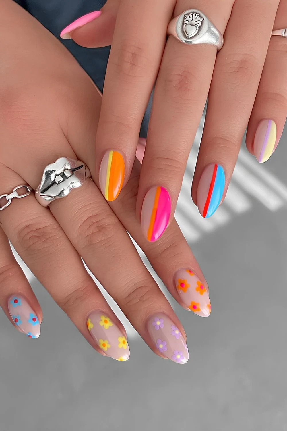 Colorful nails with bright color flowers and stripes