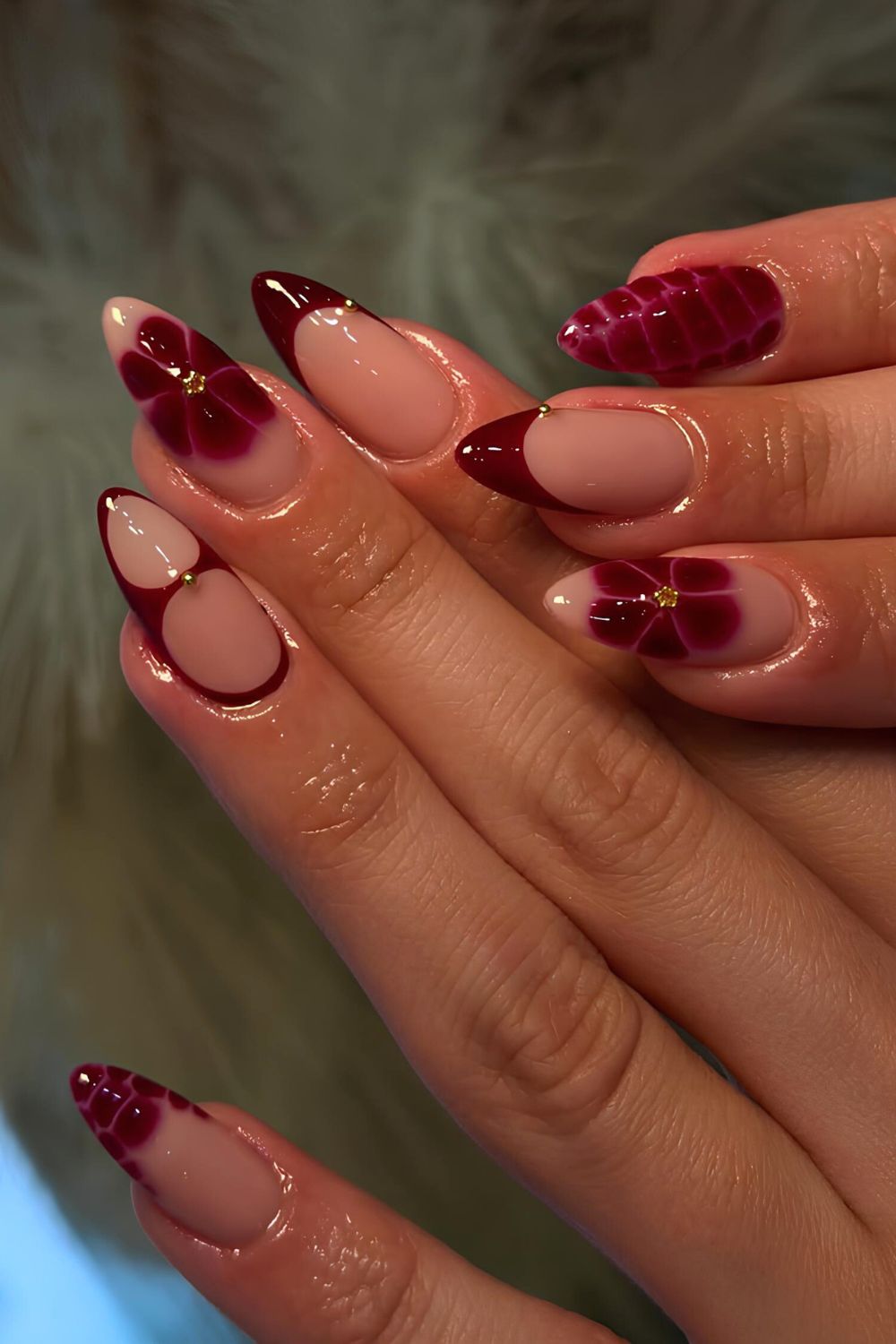 Dark red French nails with blooming flowers