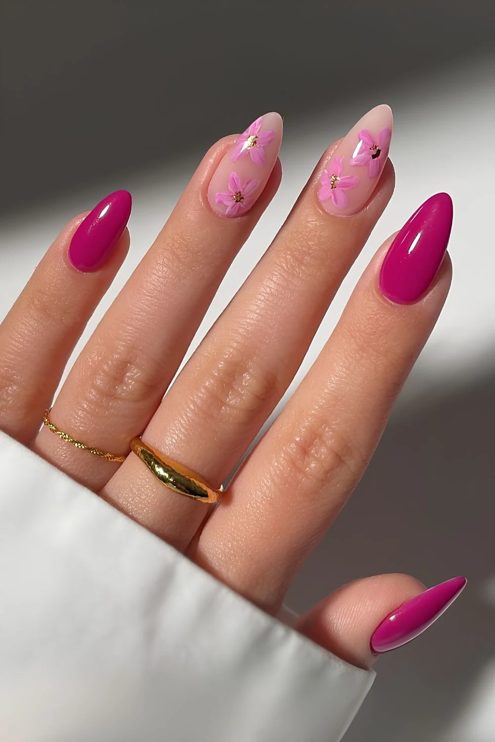 Deep pink nails with floral art