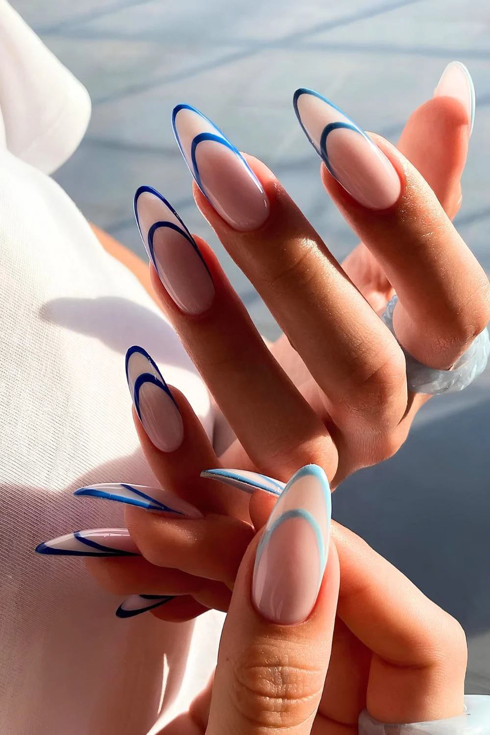 Double French mani in blue shades and milky base