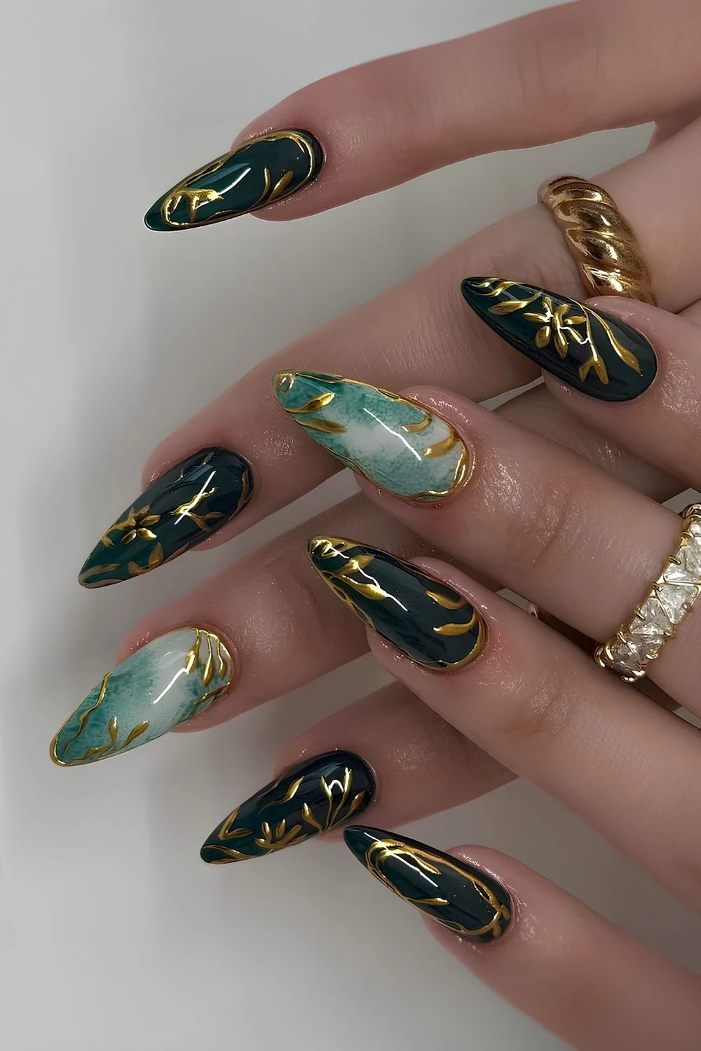Emerald green nails with gold and marble details