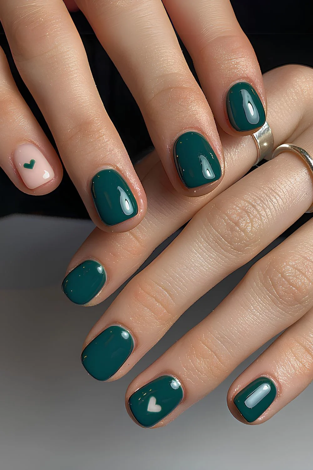 Emerald green nails with hearts