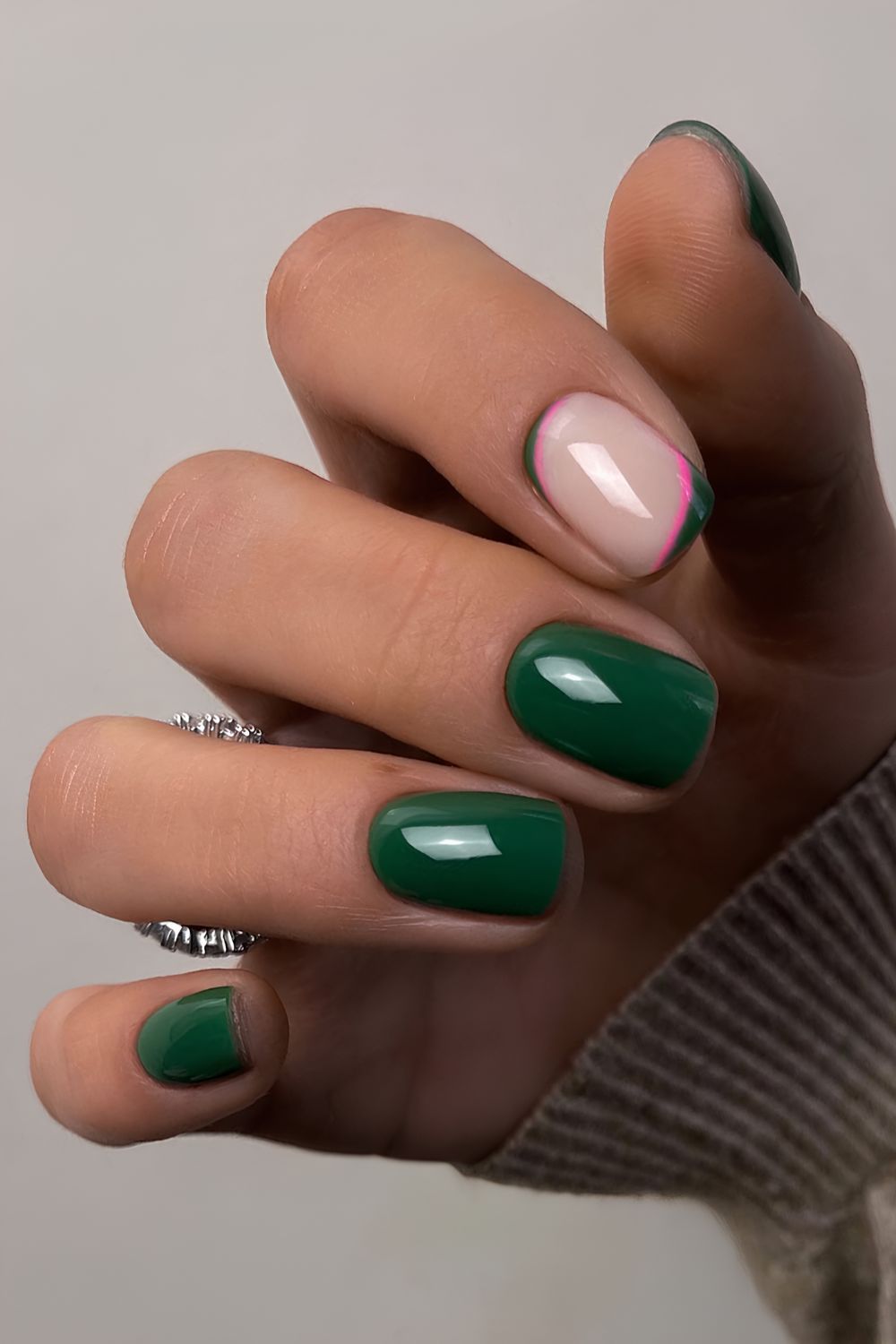 Emerald green nails with pink accents