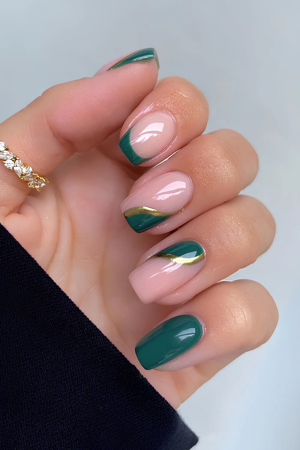Emerald green nails with side swoop accents
