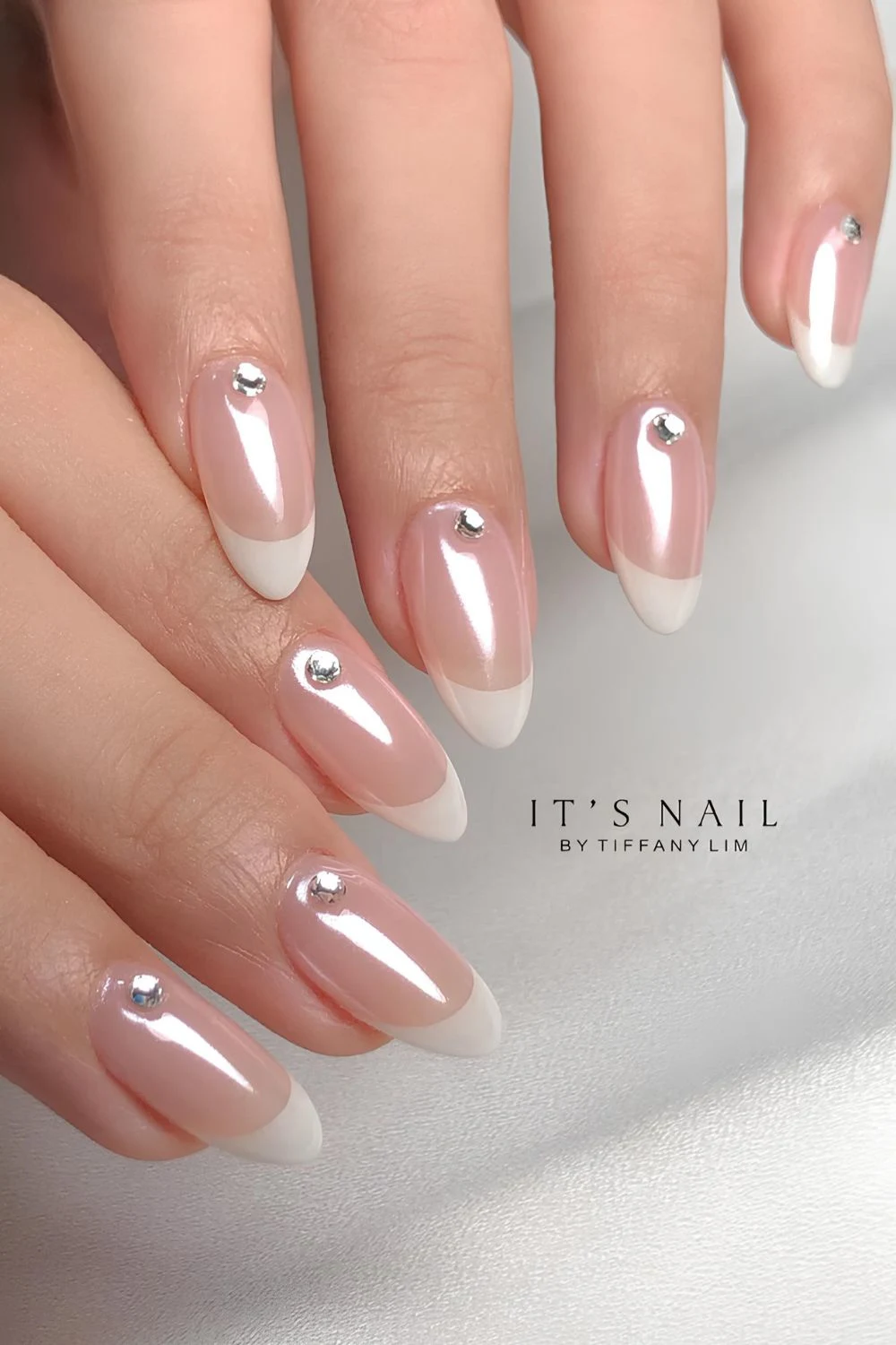 Glazed white French mani with rhinestones