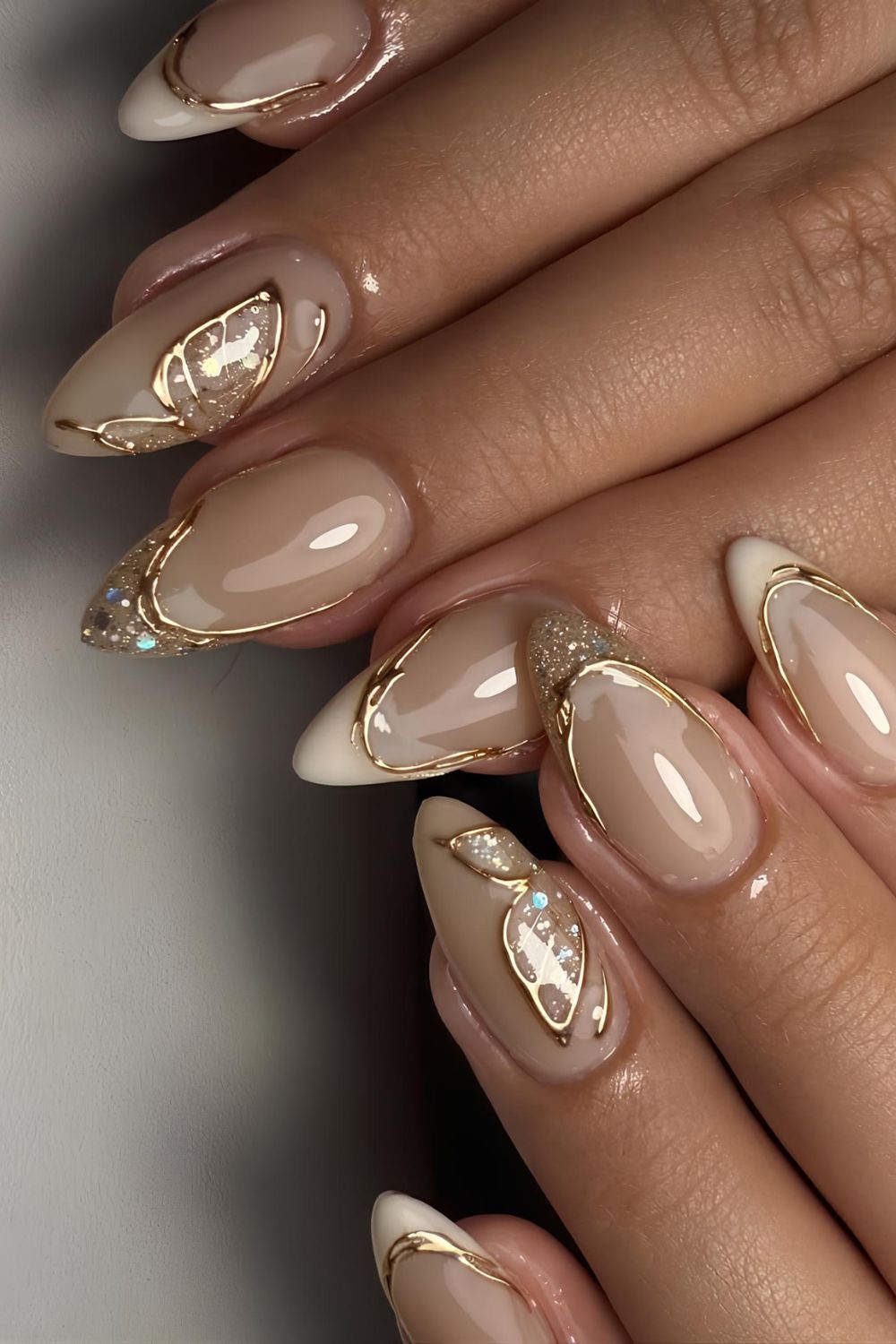 Glowy beige French mani with gold chrome accents