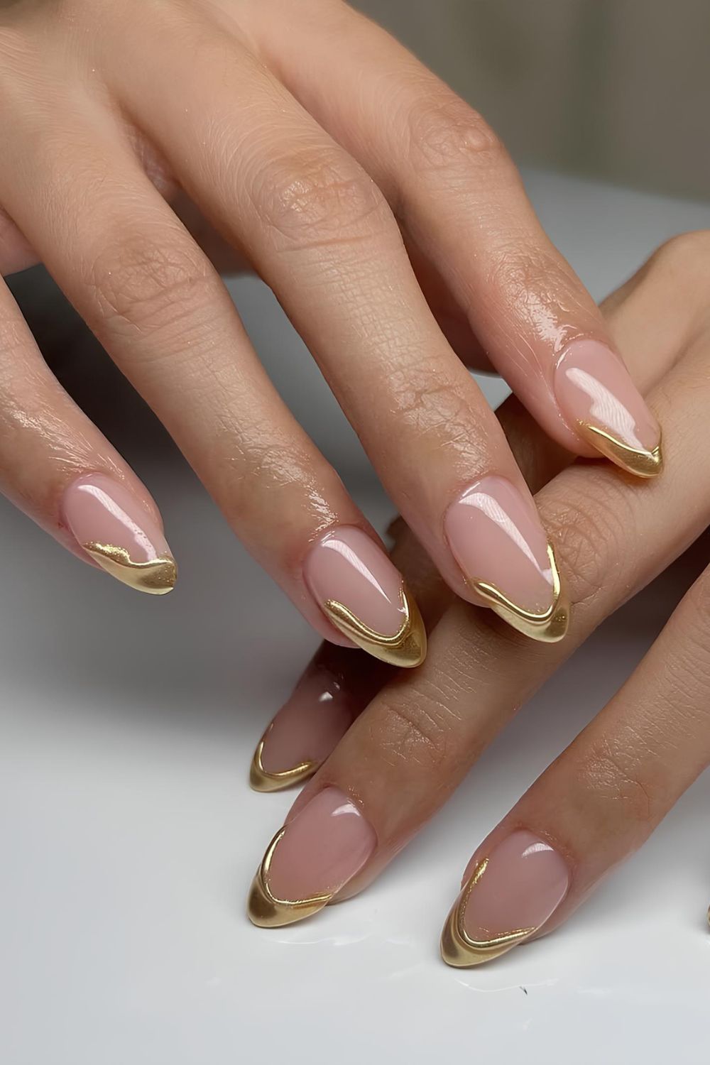 Gold French mani with drip design