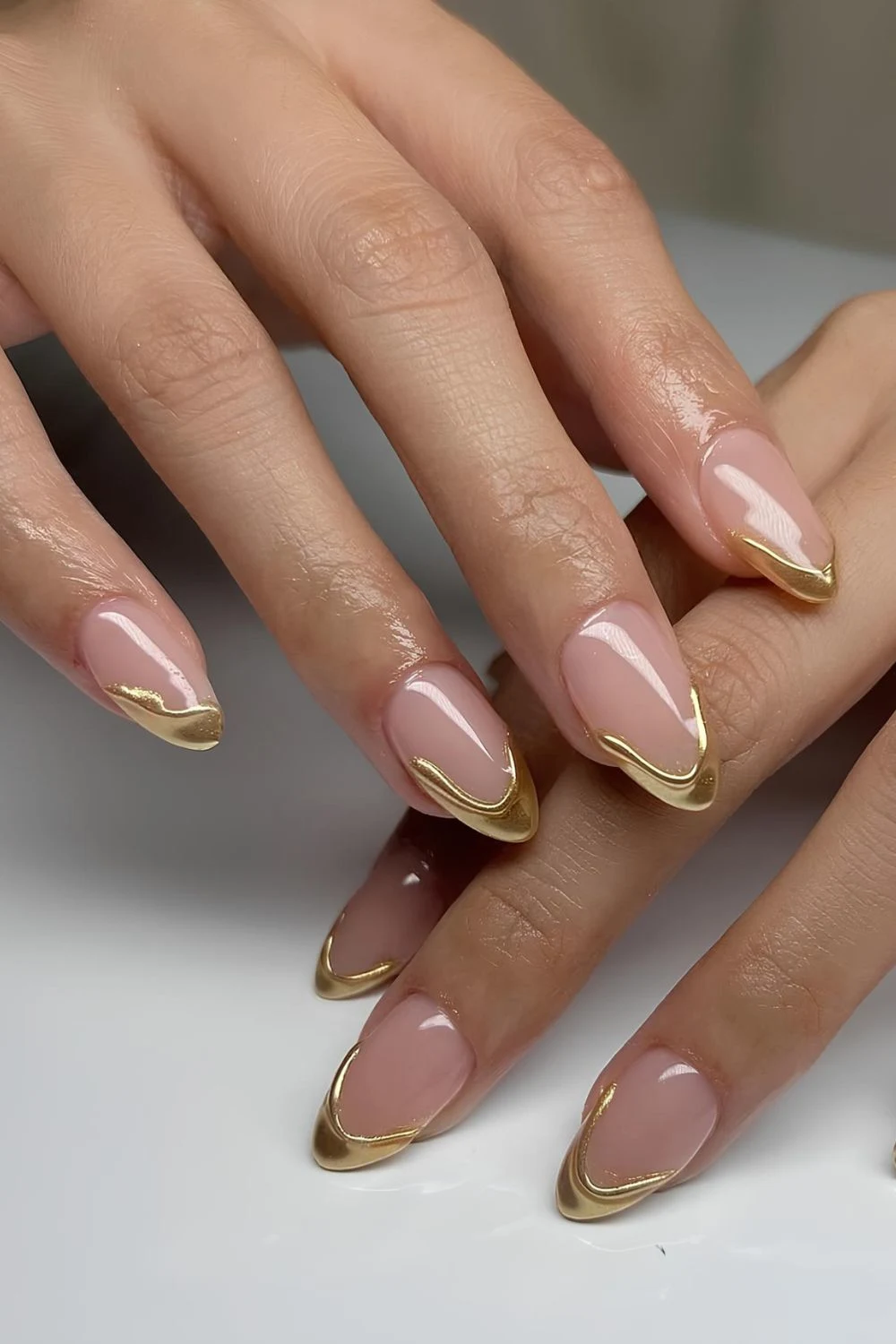 Gold French mani with drip design