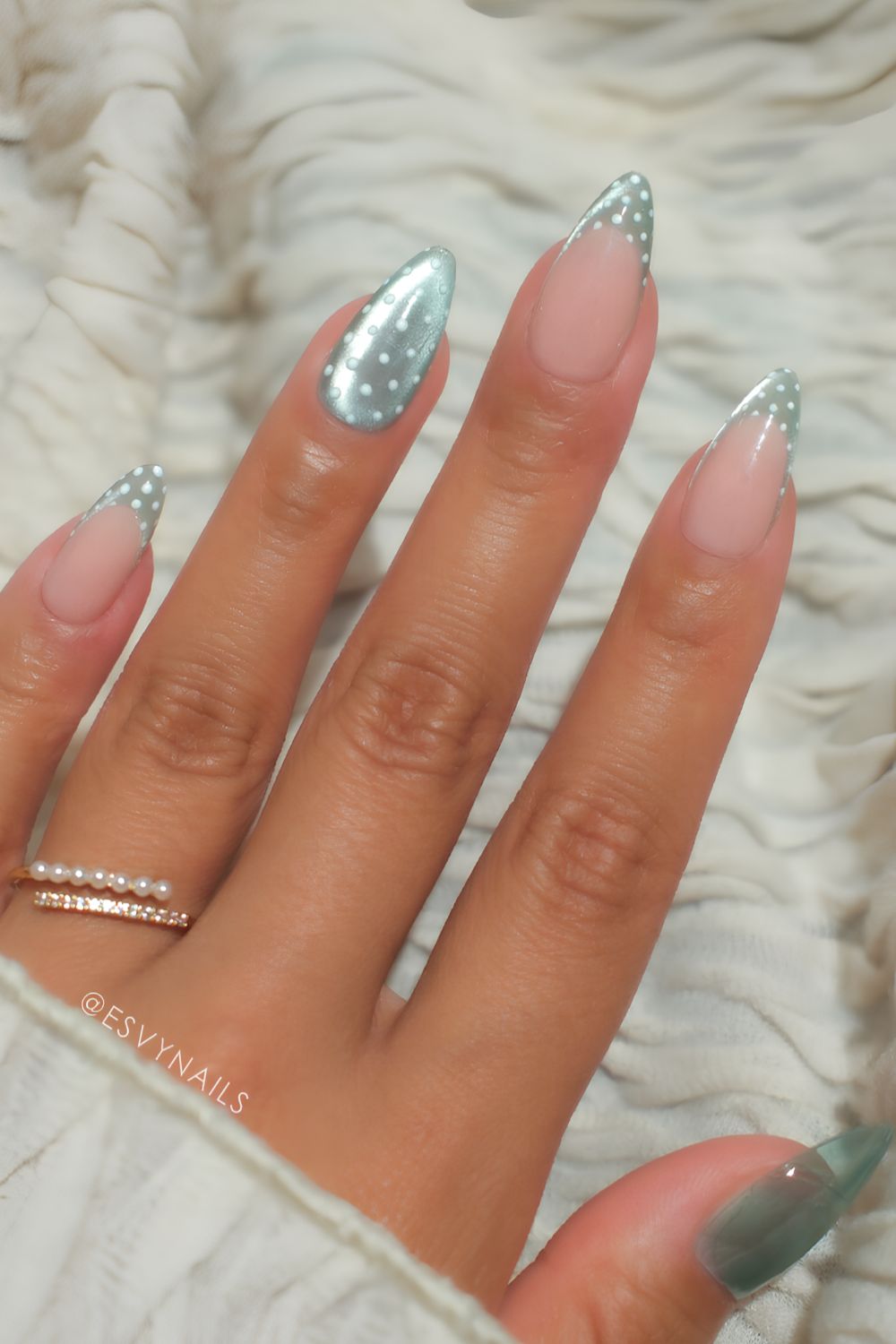 Green cat eye nails with polka dot art