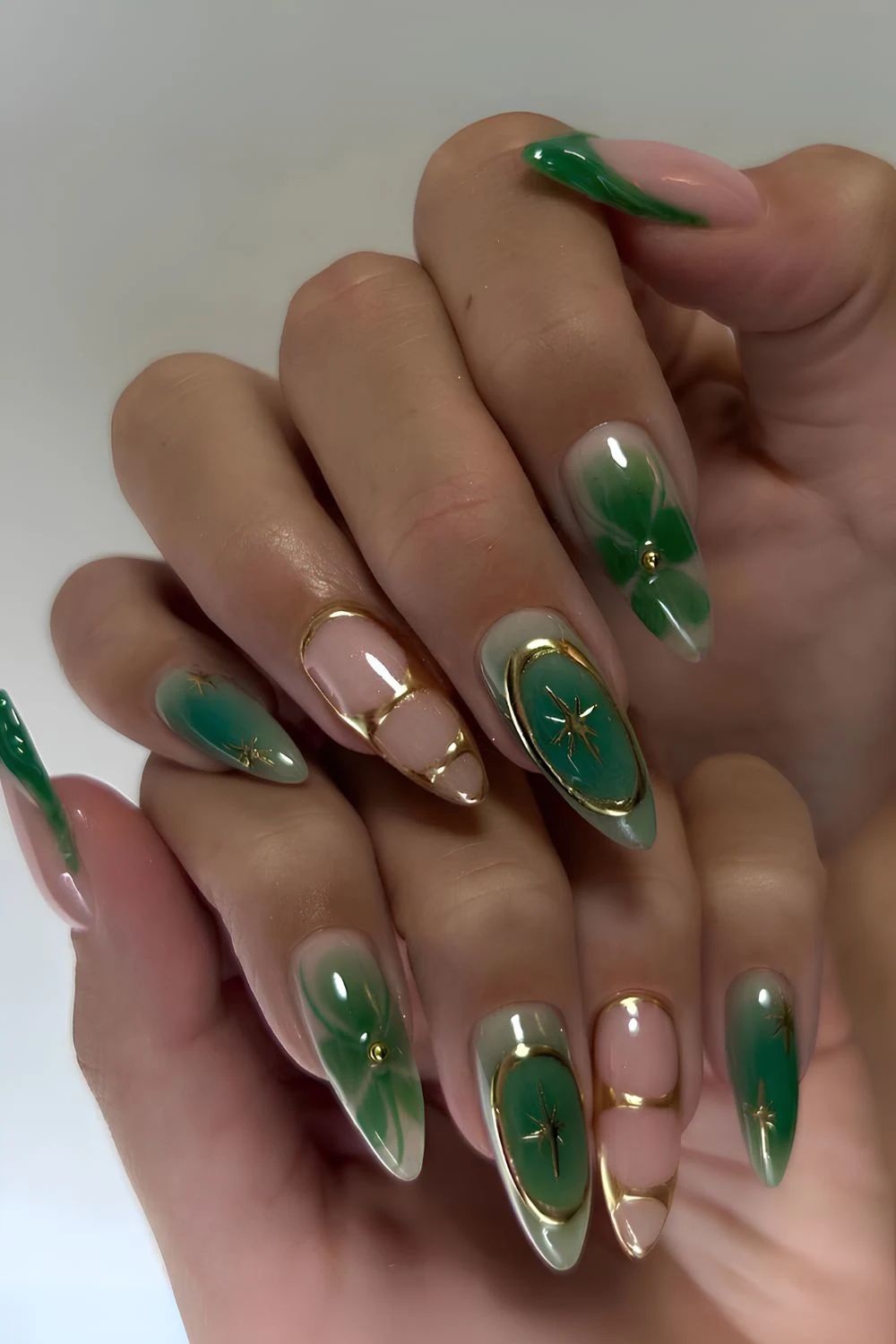 Green nails with gold and floral details