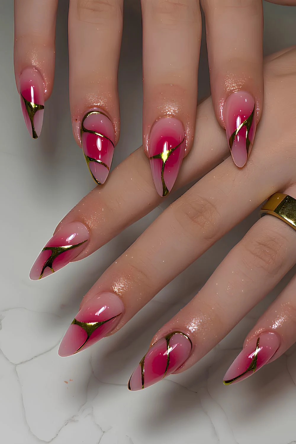 Hot pink aura nails with metallic swirls