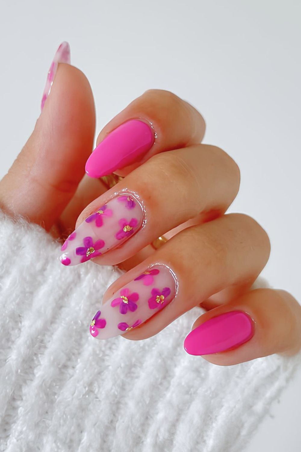 Hot pink nails with florals and gold foil accents