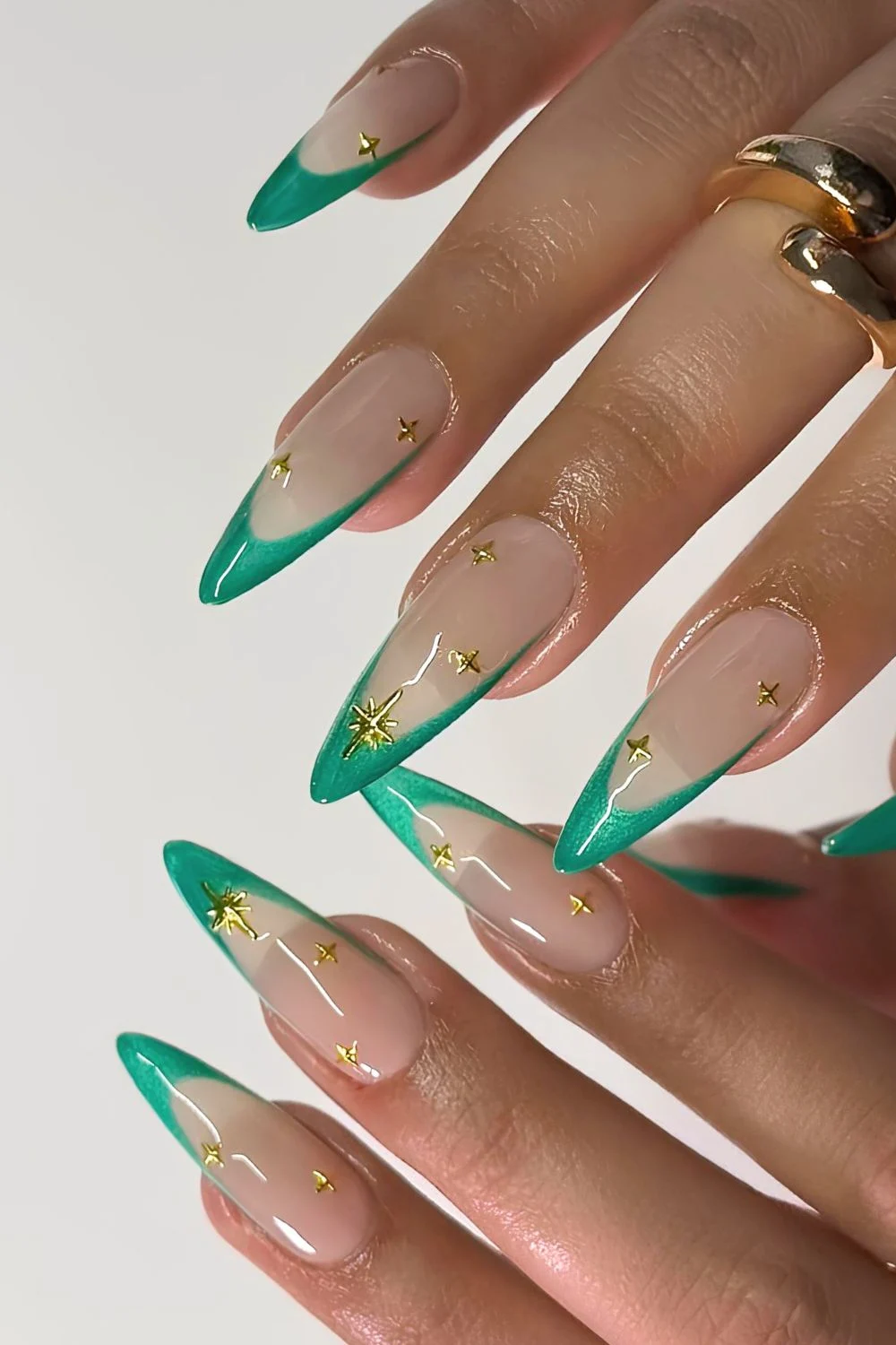 Jelly green French mani with gold star accents