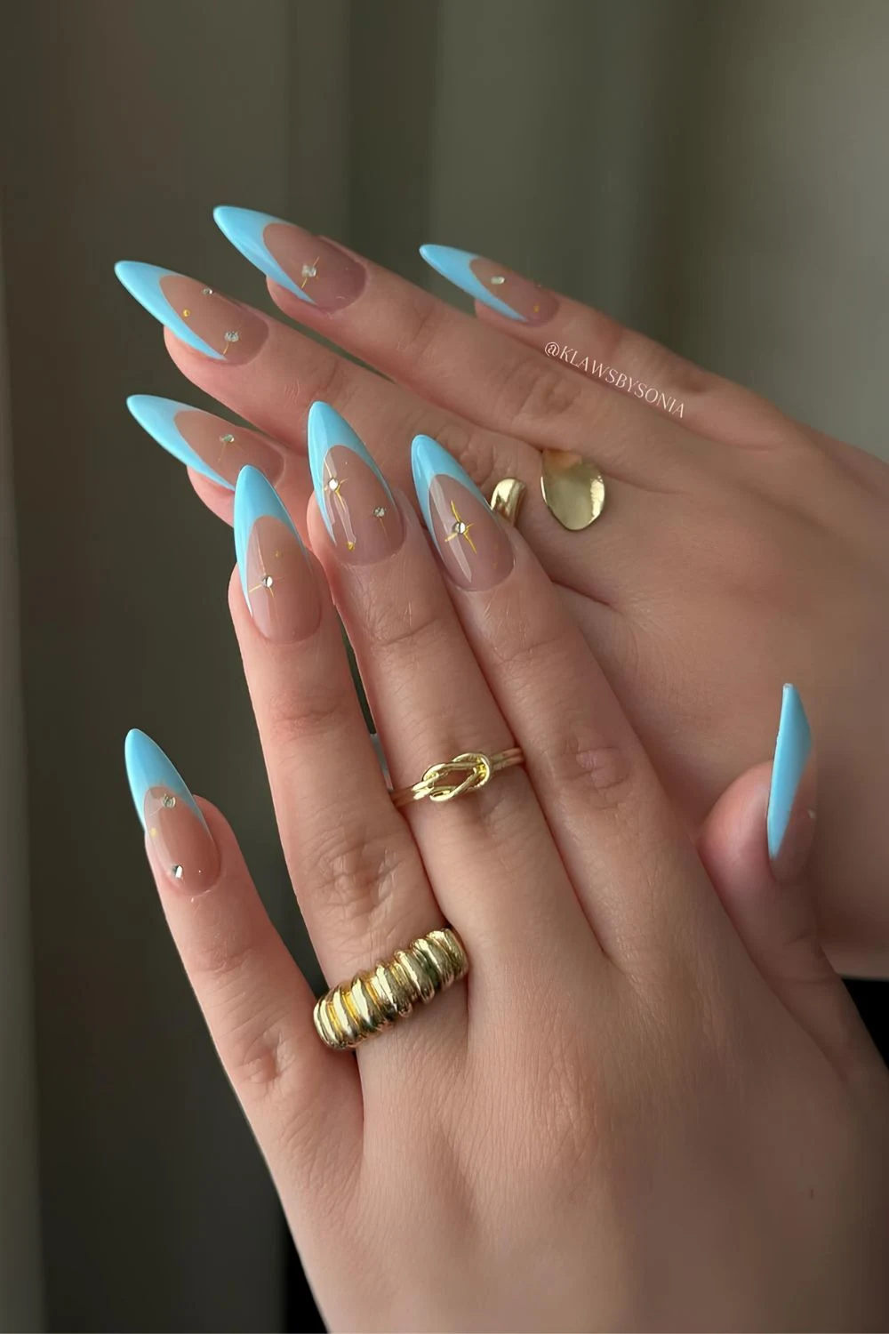 Light blue French mani with rhinestones