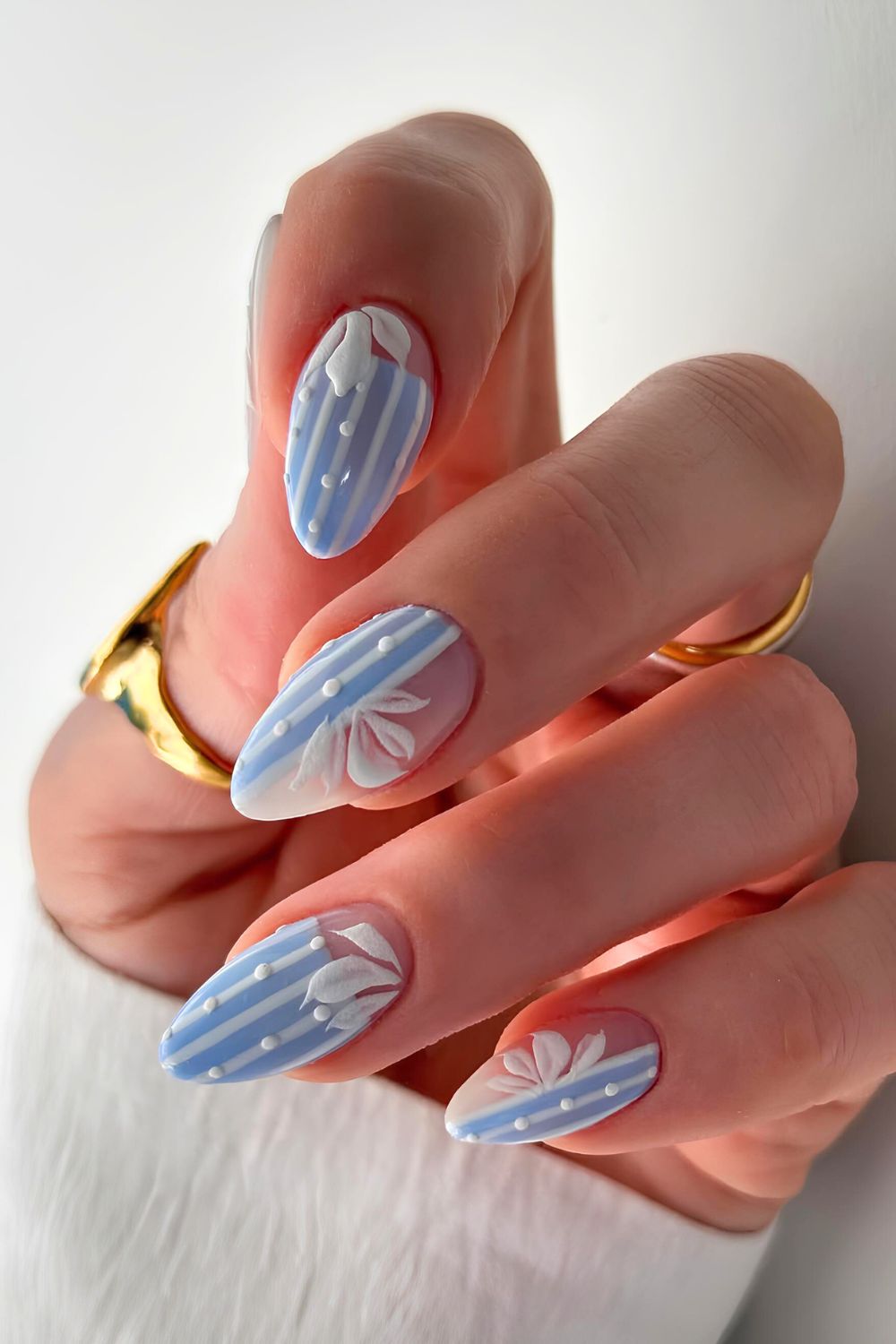 Light blue and white matte nails with florals and dots
