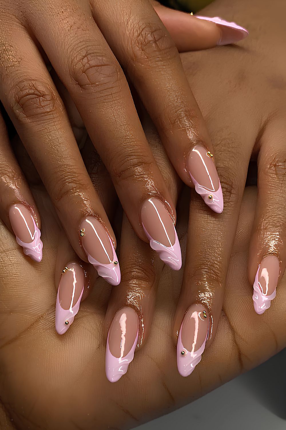 Light pink French nails with raised swirls