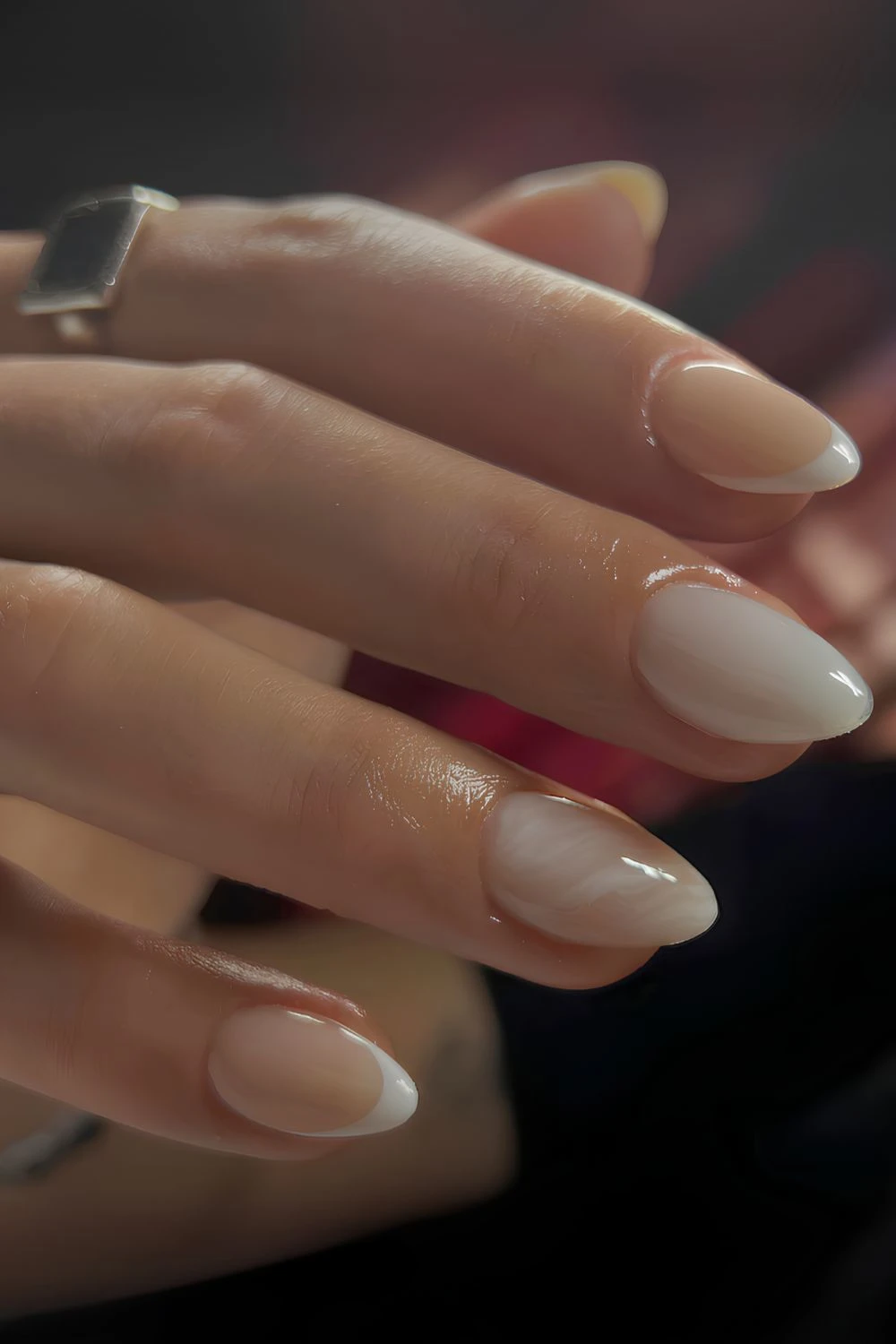 Milky nails with accent French tips and marble swirls