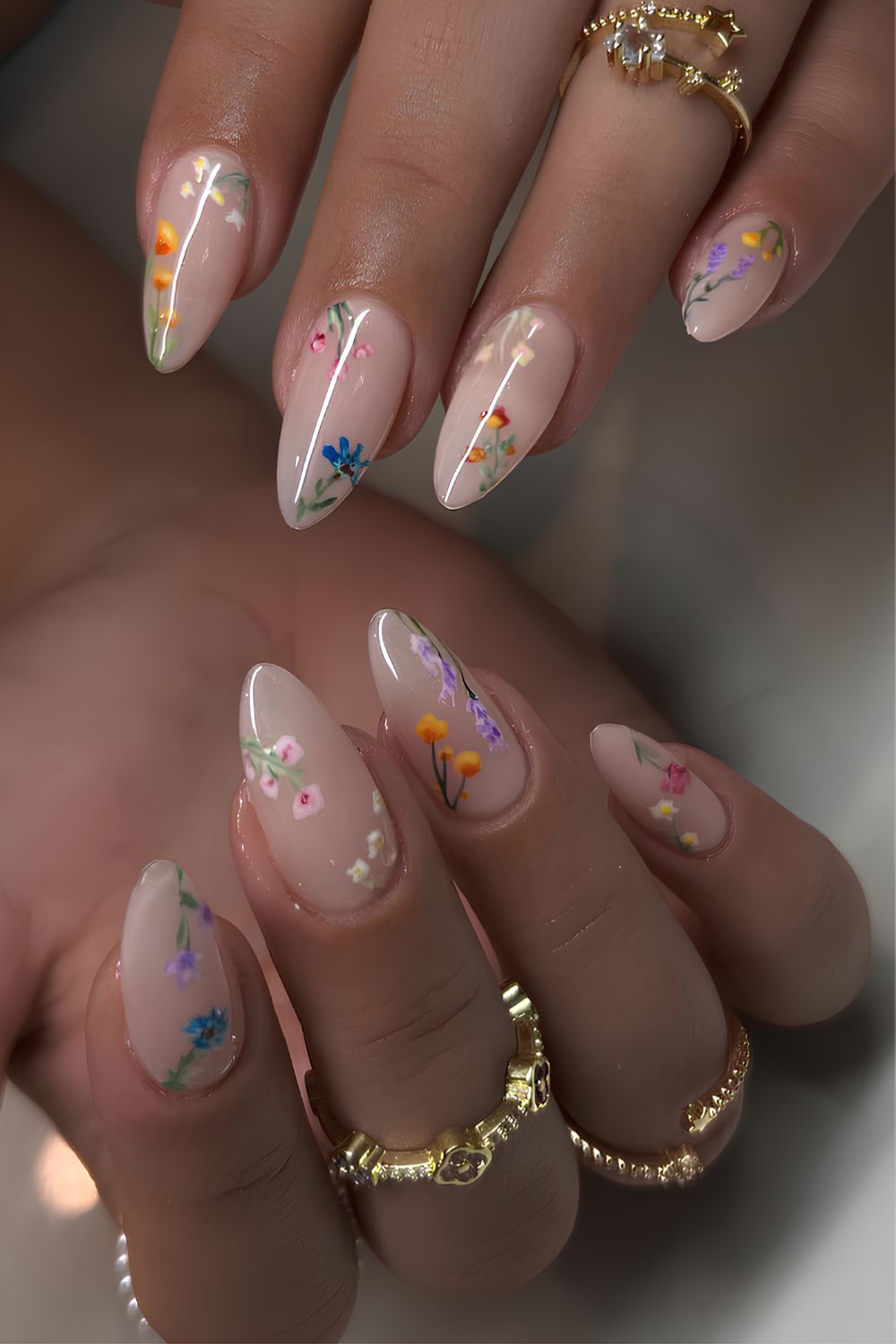 Milky white nails with colorful floral details