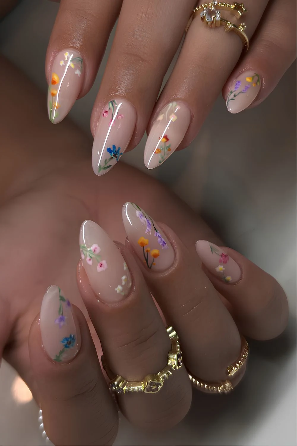 Milky white nails with colorful floral details