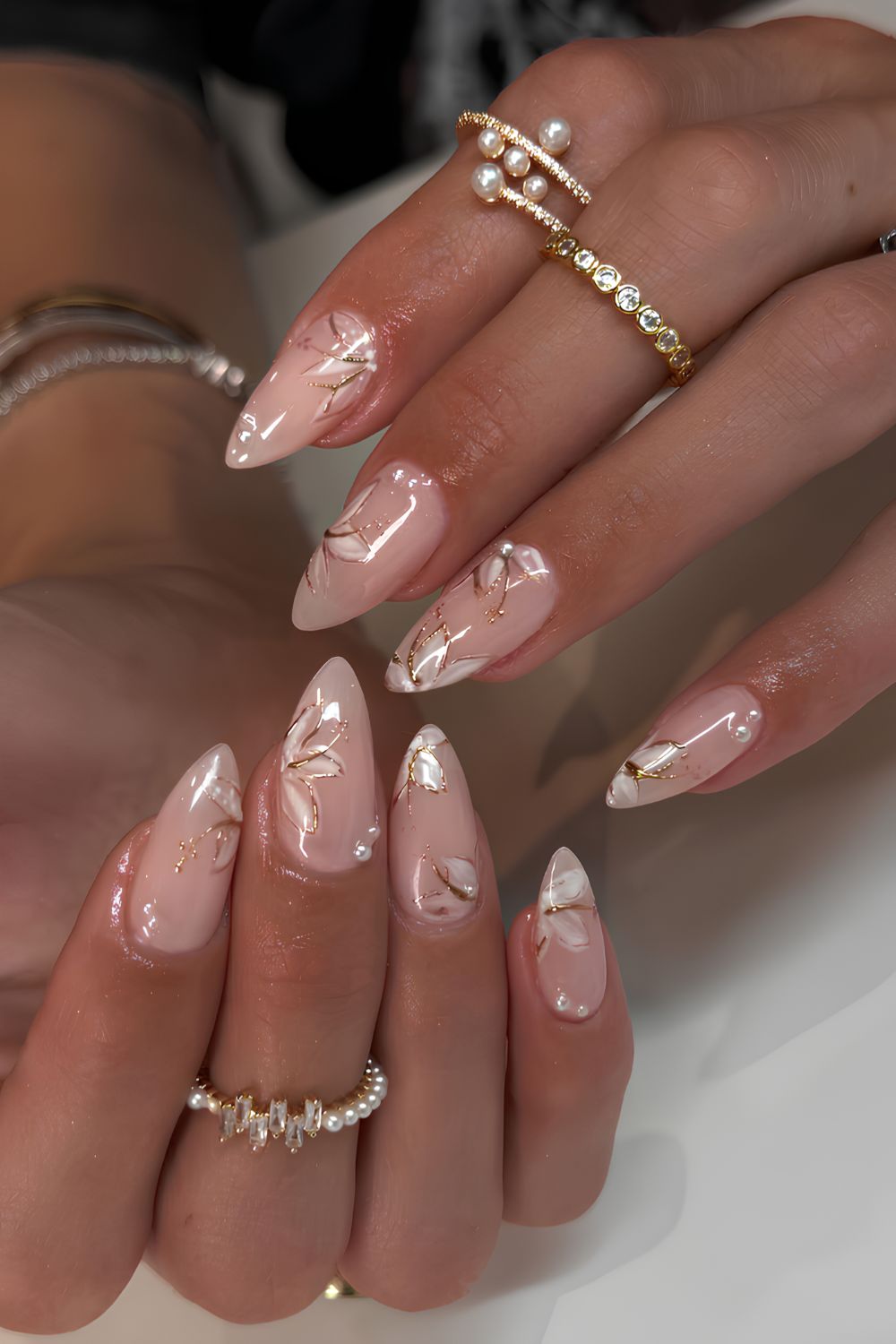 Milky white nails with gold floral art