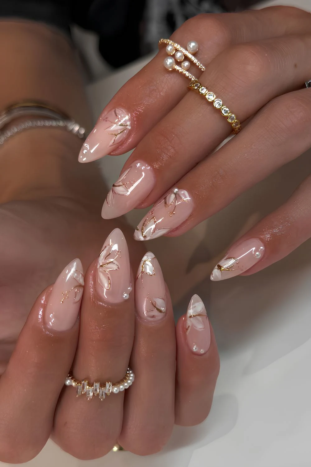 Milky white nails with gold floral art
