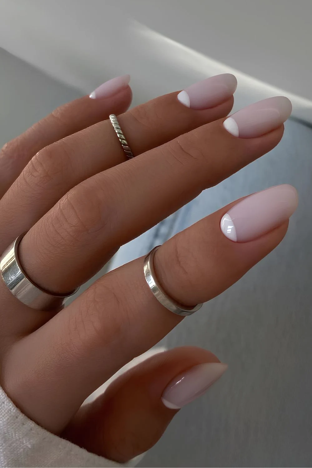 Milky white nails with half moon accents