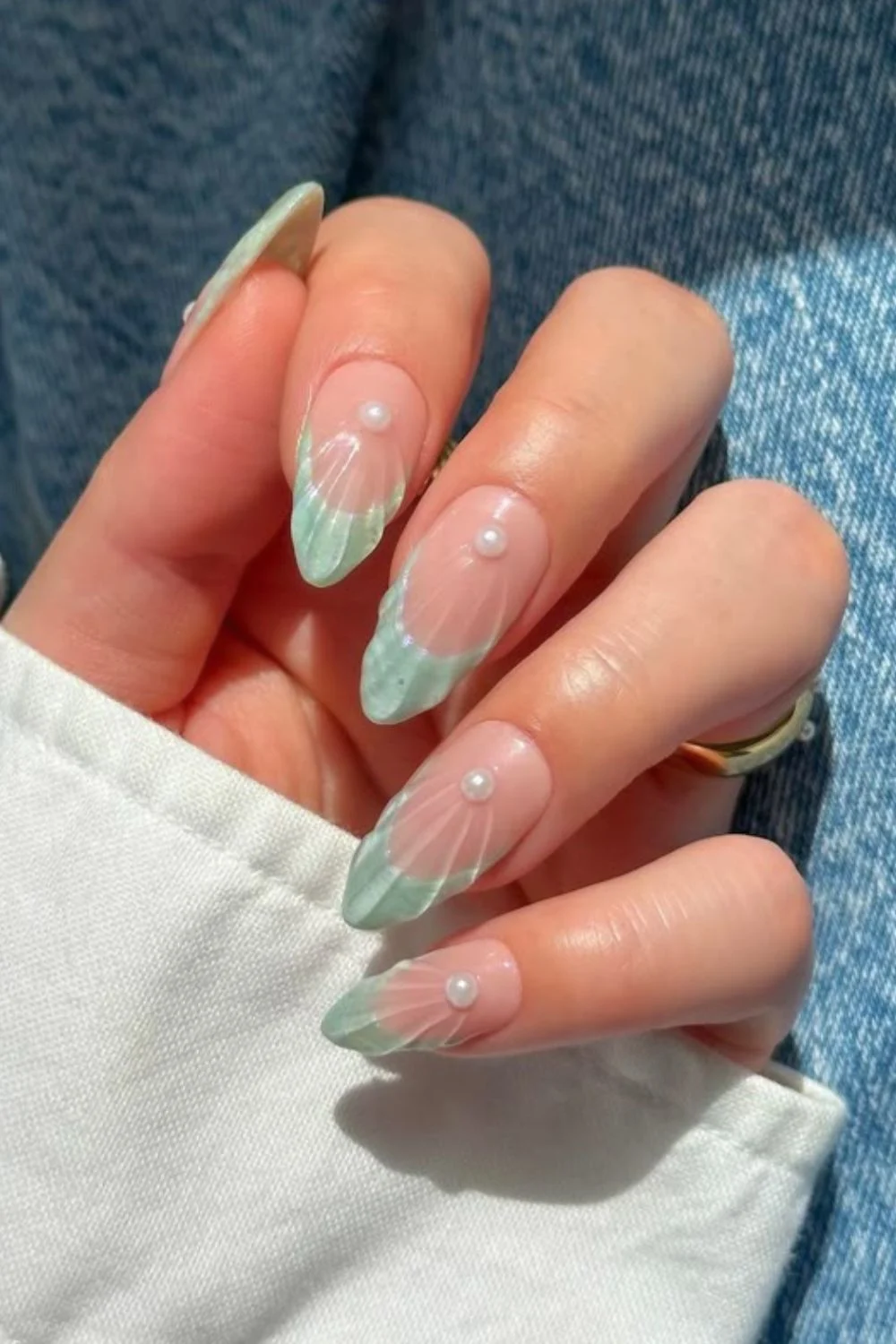 Mint green seashell French nails stacked with pearls