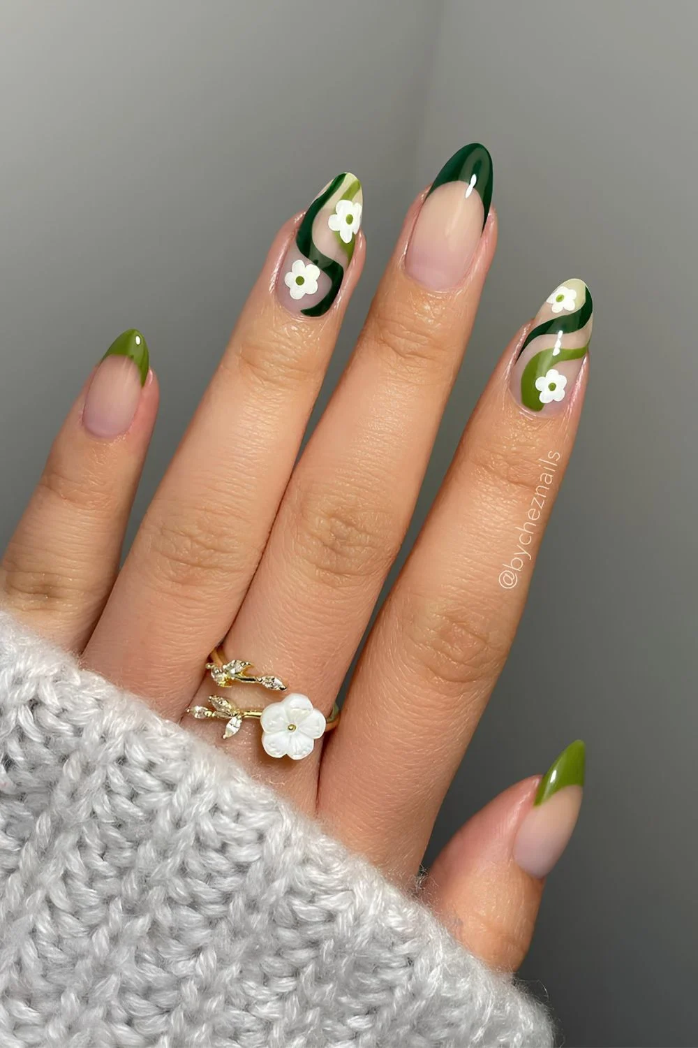 Mix of dark and olive green French mani with swirls and florals