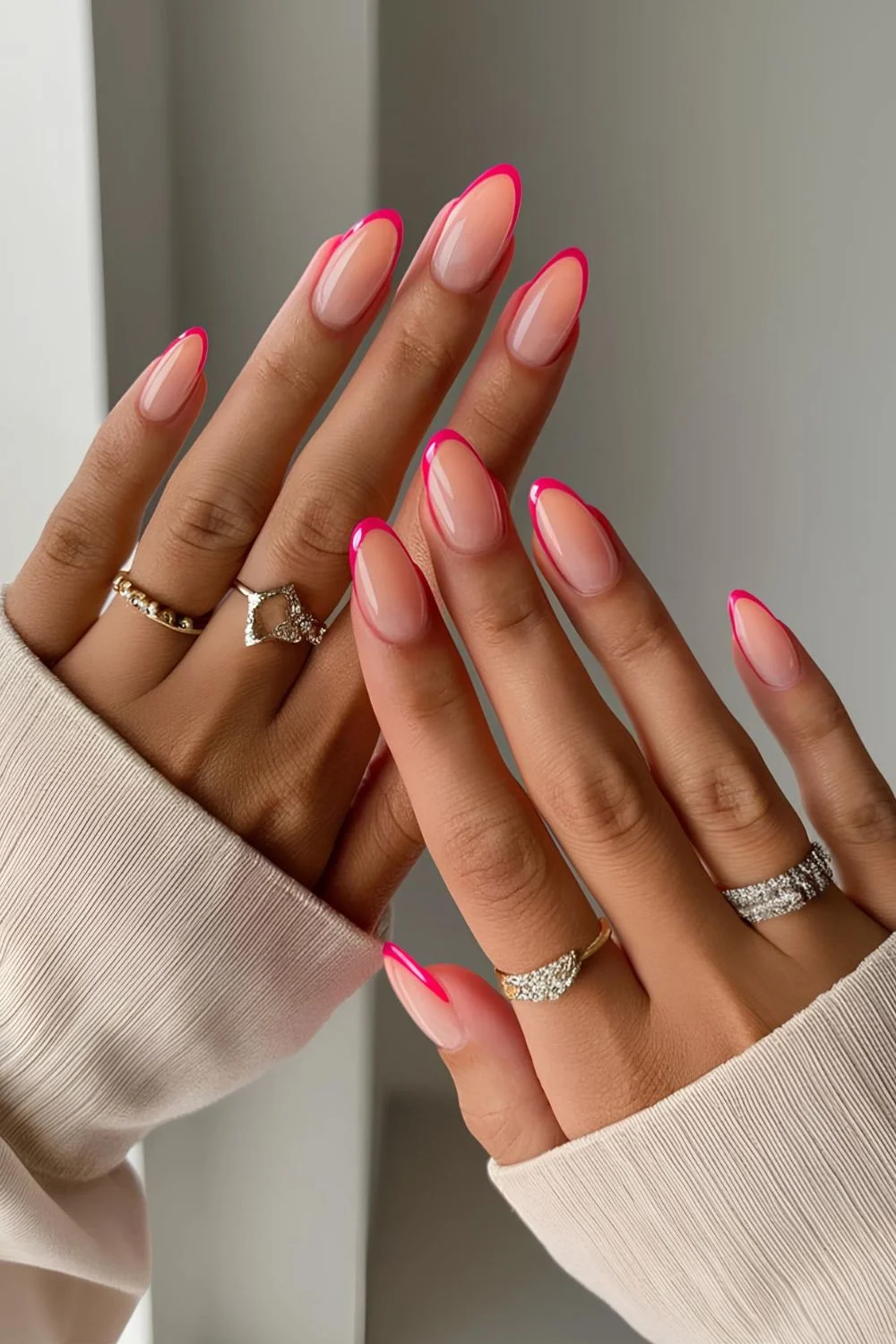 Neon pink French almond nails
