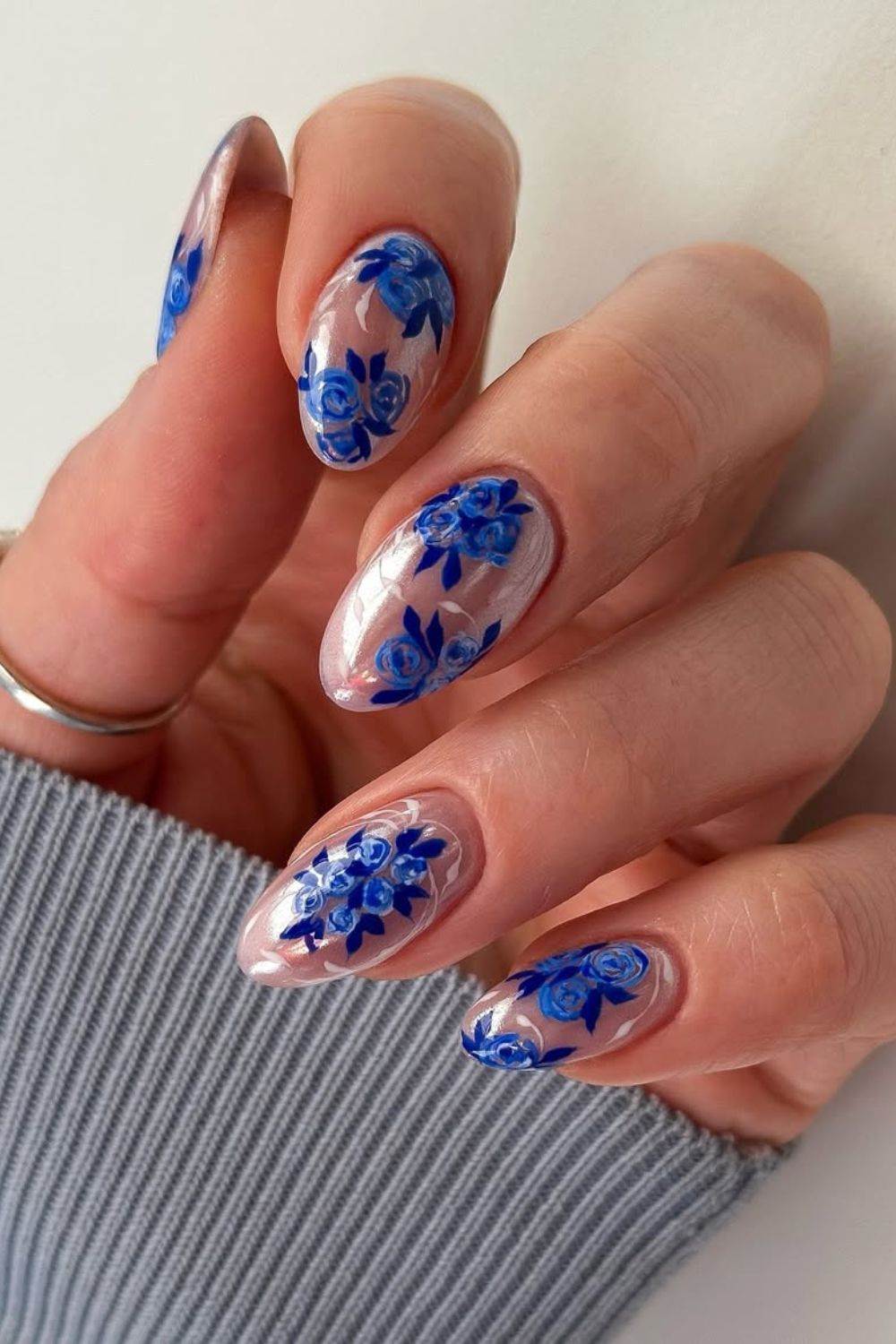 Neutral chrome nails with blue florals