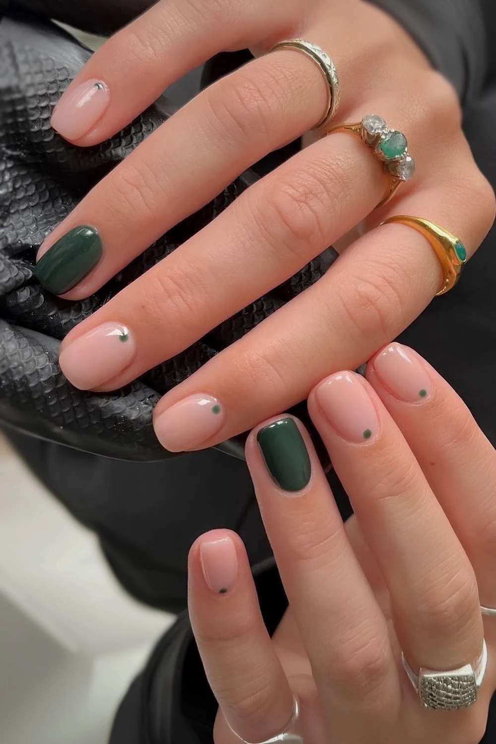Neutral nails with emerald green accents