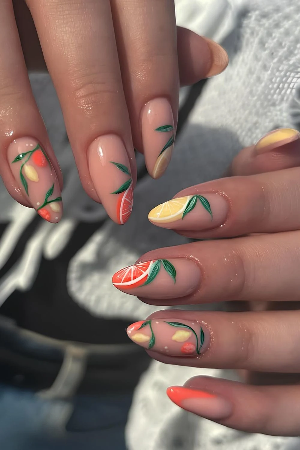 Neutral nails with lemon and orange with green accents