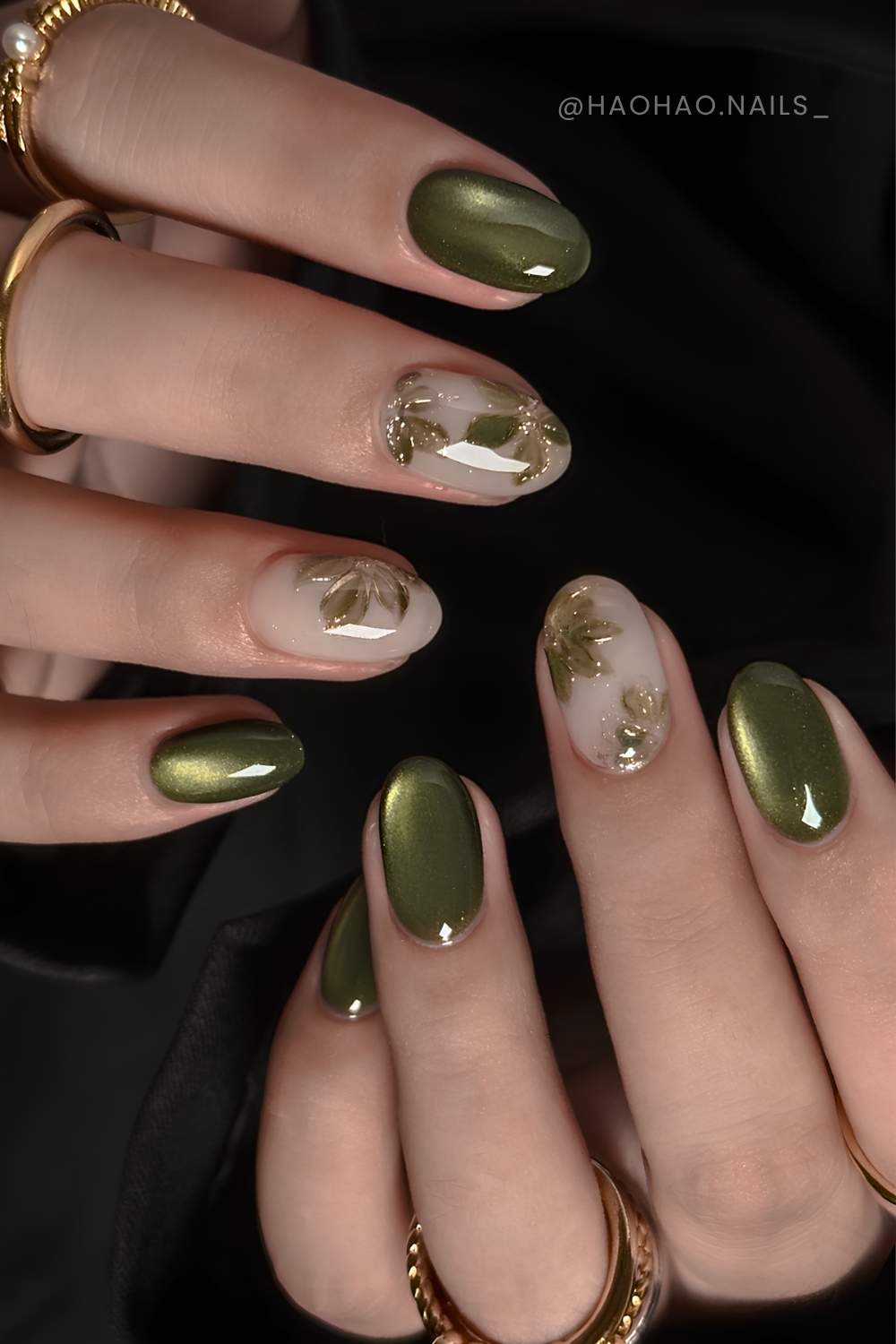 Olive cat eye nails with accent flowers