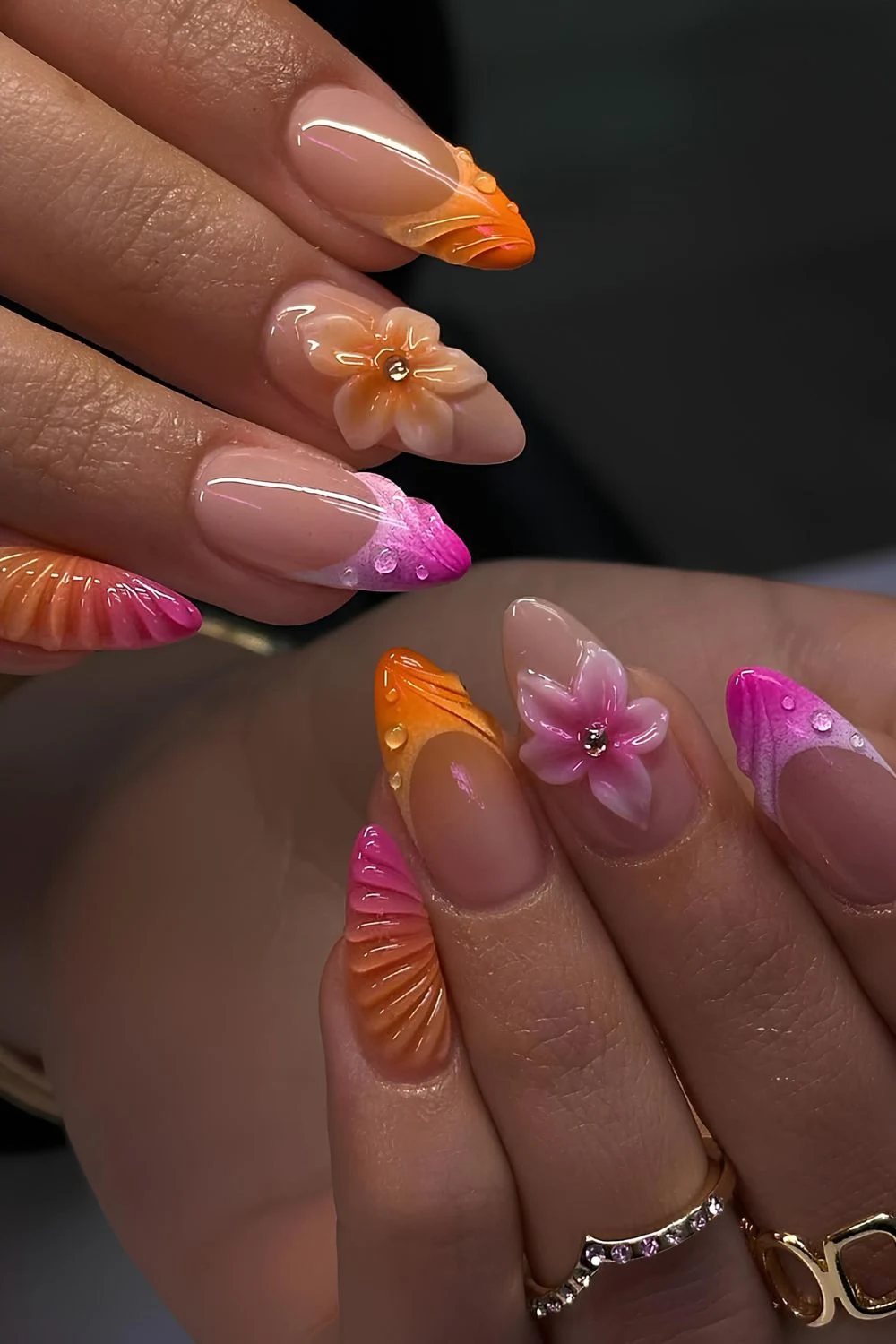 Pink and orange French mani with 3D designs