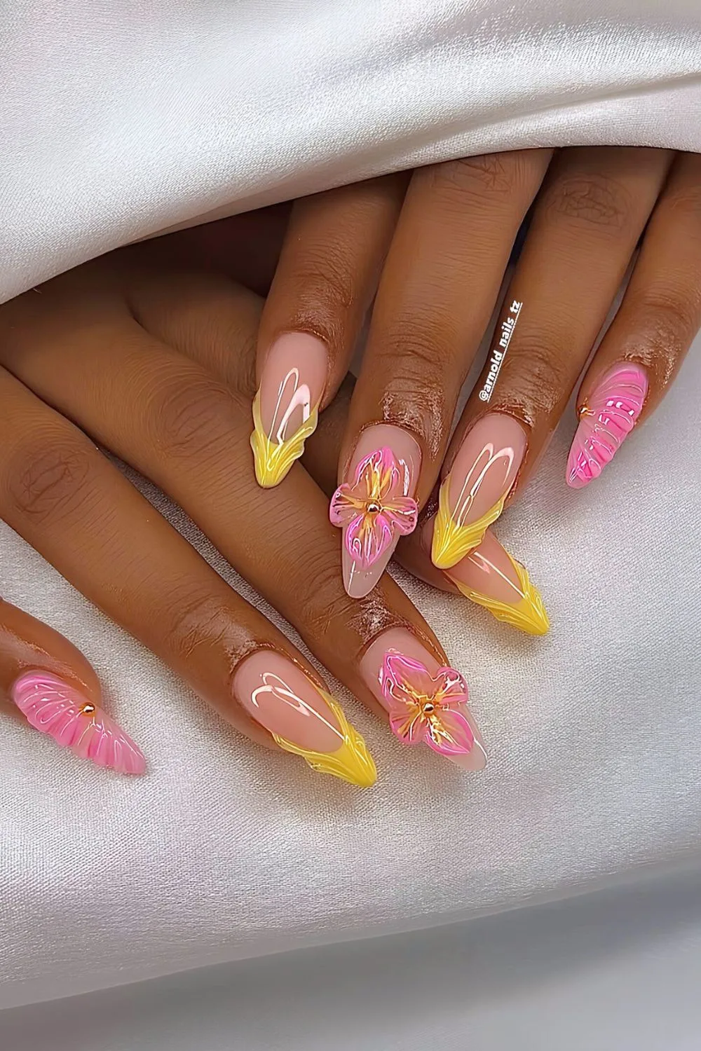 Pink and yellow French nails with sculpted tips and florals