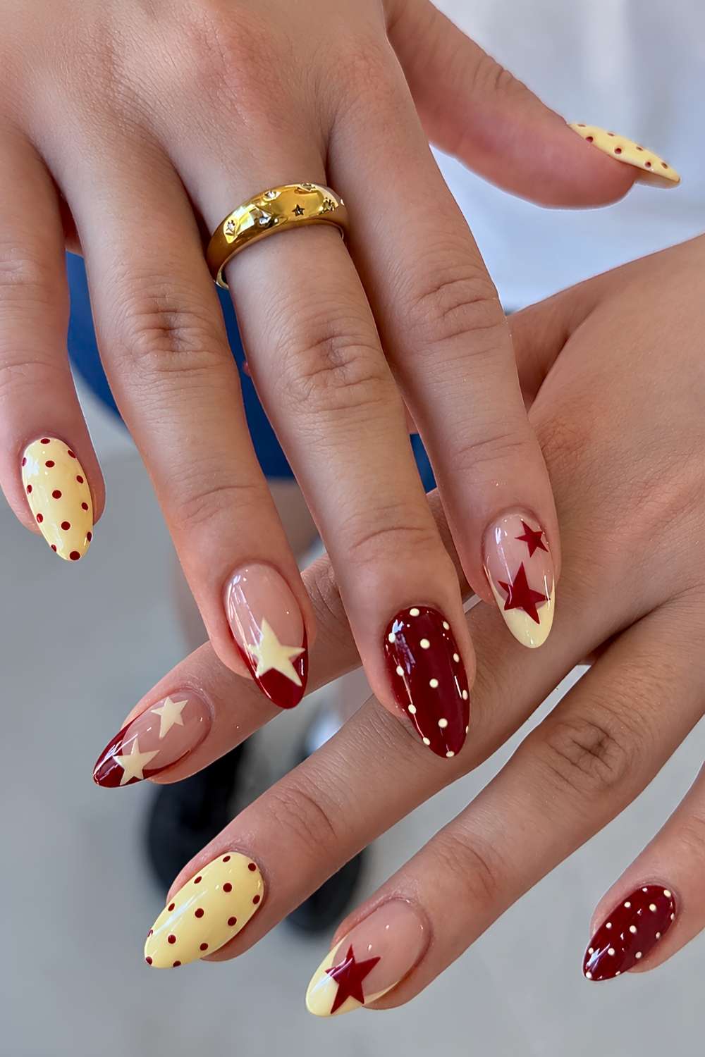 Red and yellow nails with stars and polka dots