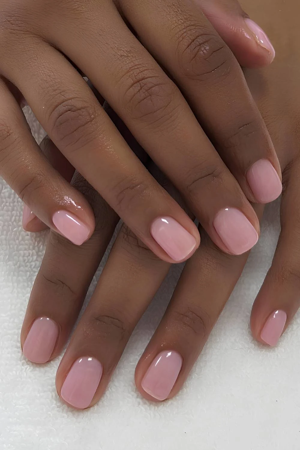 Sheer strawberry pink manicure