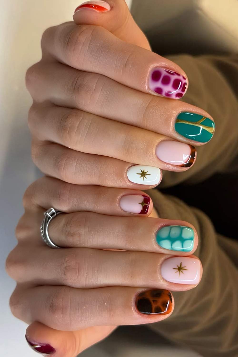 Short mismatched nails with animal print