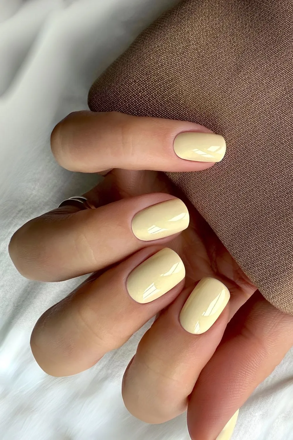 Short nails in solid butter yellow hue