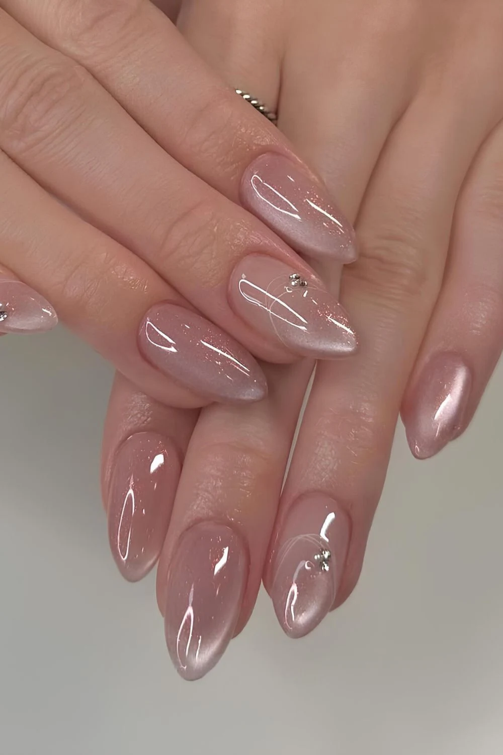 Soft pink glass nails with rhinestone accent