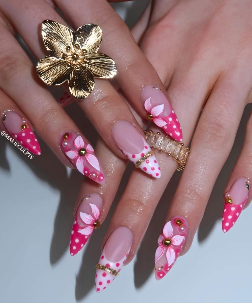 Vibrant pink nails with dots and 3d flowers