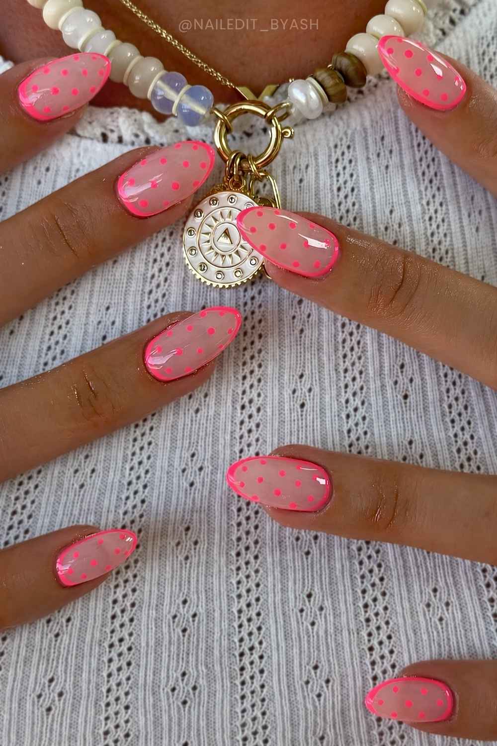 Vibrant pink polka dot manicure