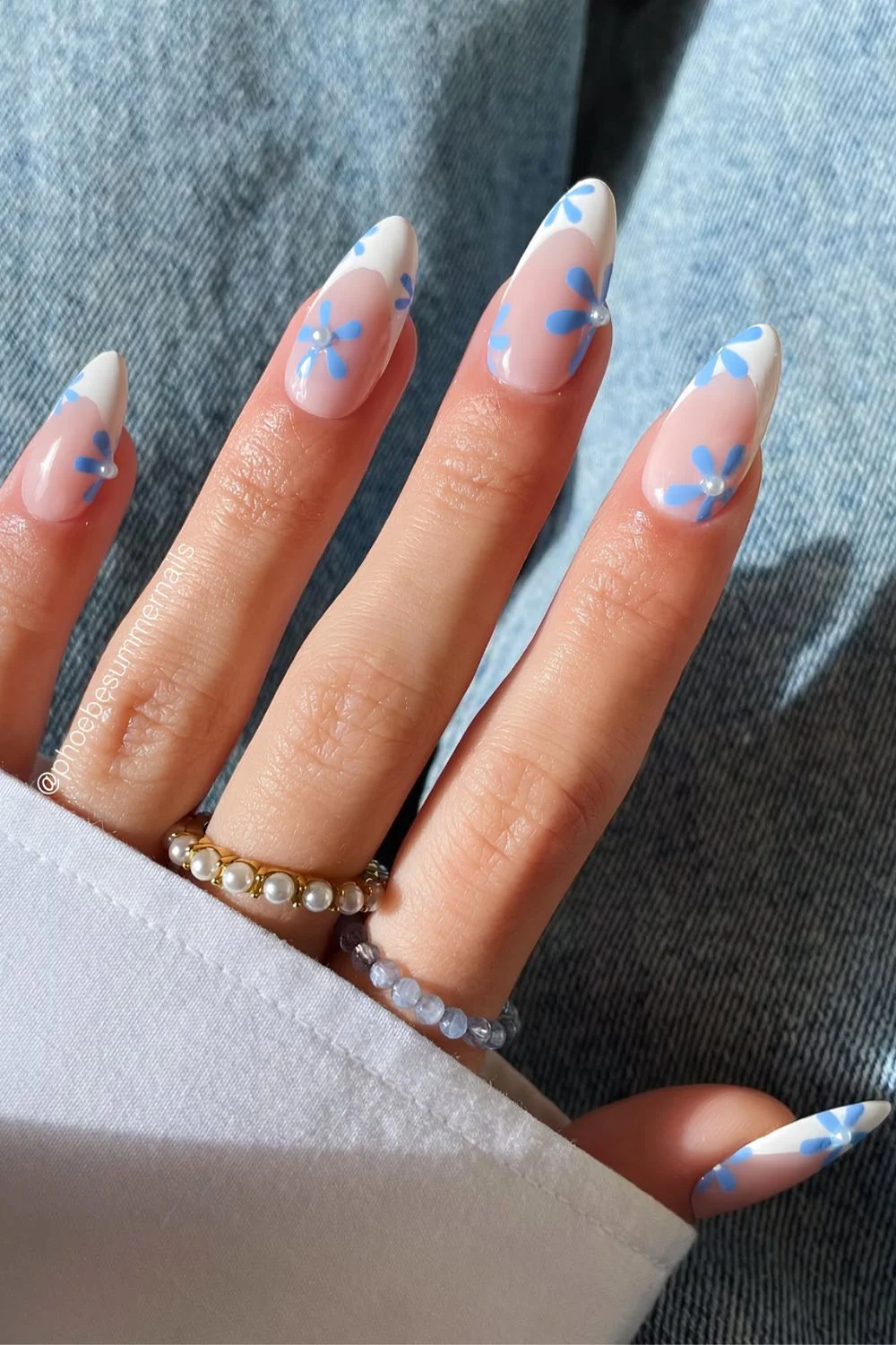 White French mani with blue flowers and pearl accents