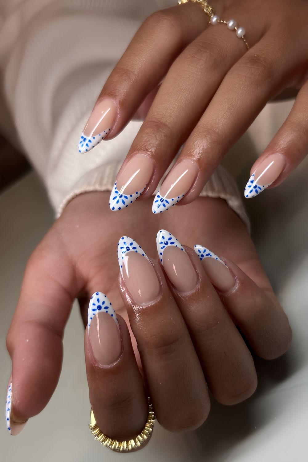 White French mani with blue mediterranean flowers